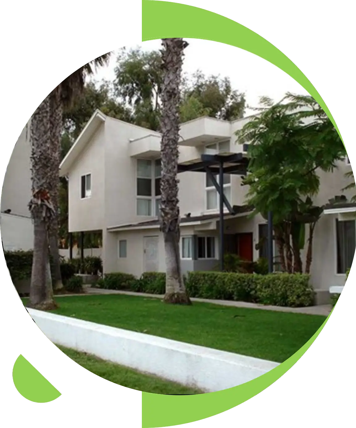 Modern house with trees and green lawn.
